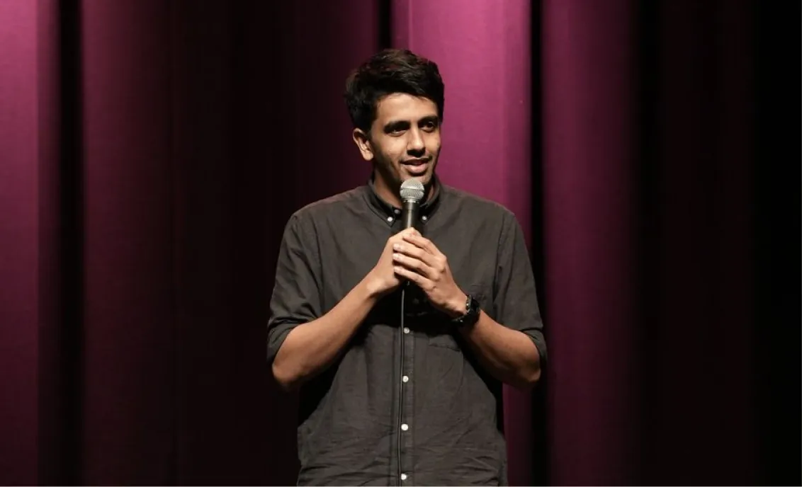 Gautham Govindan performing stand-up on stage